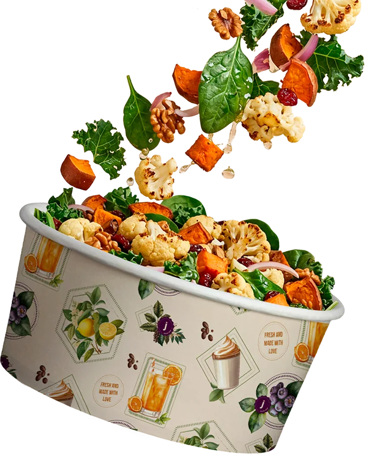 Taça de salada fresca com ingredientes a cair lá para dentro